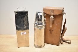An early 20th-century leather huntsman’s flask case, containing a presumed silver-plated Thermos