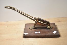Thought to be 19th-century brass tobacco cutter mounted to a wooden base, unmarked, 23.5cm x 15cm