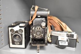 Three cameras. An Olympus Trip 35 with a No1 Pocket Kodak Junior and a Kodak Brownie Six-20 Model