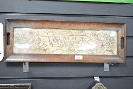 An early 20th-century wooden serving tray, featuring hand-screen and painted insert under glass that