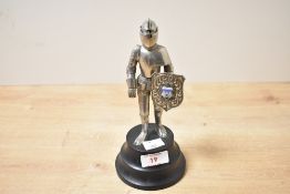 A 20th-century German metal knight-in-armour table lighter, the hinged visor opening to activate the