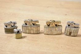 Two mid 20th-century Ronson Milady mother-of-pearl inset cigarette lighters; sold with a Hestia Baby