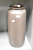A tall mid 20th-century West German floor vase, featuring a speckled dark brown glaze, marked to