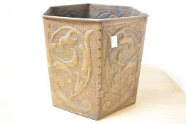 A large early 20th-century Arts and Crafts copper jardinière, of octagonal-form, featuring embossed,