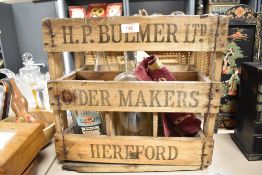 A 20th-century wooden Whitebread beer crate containing four empty bottles inlcuding PJ & Arnold