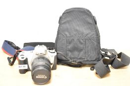 A Canon EOS300 camera with Canon Zoom EF 28-105mm 1:4-5,5 lens in soft camera bag
