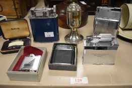A group of seven 20th century metal lighters including D Morgan Rees and Sons ltd and an Art-Deco