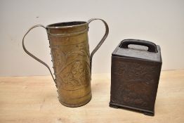 An early 20th-century Arts and Crafts brass twin-handled vase, of cylindrical form, featuring