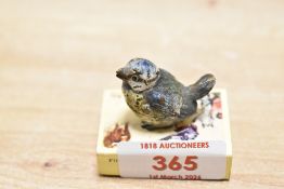 A miniature early 20th-century Austrian cold-painted bronze blue tit figurine, featuring delicate