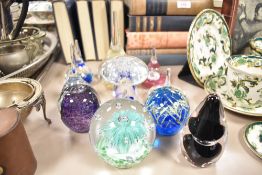 A group of ten 20th century glass paperweights to include a Mdina featuring the classic chevron