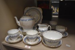 A quantity of 20th century Tuscan plant bone china tea and dinner service featuring a blue and green