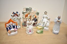 A quantity of 19th-century Staffordshire pottery flat backs and fairings, to include John Wesley;