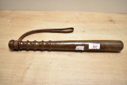 A 20th-century Hiatt and Company turned hardwood police officers truncheon, having original