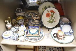 A selection of 20th-century French Quimper pottery by HB-Henriot, featuring a selection of folk-