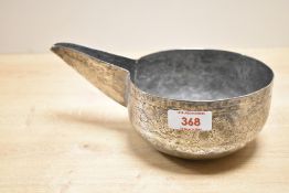A presumed 19th-century white metal Omani (Bahla) camel milking bowl, featuring hand engraved floral