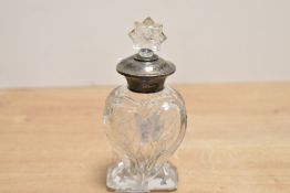 A silver mounted glass scent bottle, of balloon form having floral decoration to the body with a