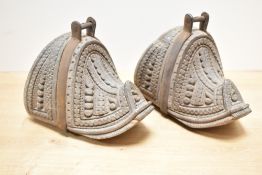 A pair of 19th-century Chilean ‘Huaso’ hand-carved wooden stirrups, featuring intricate foliate