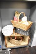 A selection of vintage wicker baskets of varying shapes and sizes, to include picnic baskets and