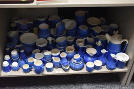A large quantity of blue and white glazed motto ware, various, to include condiments, egg cups, milk