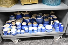 A large quantity of 20th-century Devon Blue Pottery, featuring various British town names, to