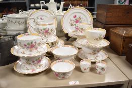 A quantity of 20th century Tuscan plant bone china tea and dinner service featuring a pink and green