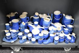 A large quantity of 20th-century Devon Blue Pottery, featuring various British town names, to
