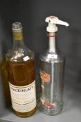 Two large vintage spirit bottles, both empty, comprising a Mackinlay's Old Scotch Whisky and a