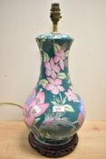 A 20th century Chinese porcelain famille vert style baluster table lamp, decorated with lotus and