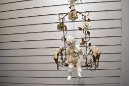 A fine early 20th-century Italian Romantic Baroque-style porcelain and iron swinging putto