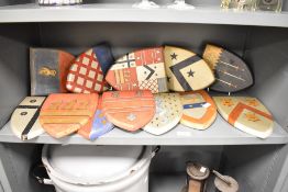 A selection of late 19th to early 20th-century wooden decorative heraldry shields, to feature hand
