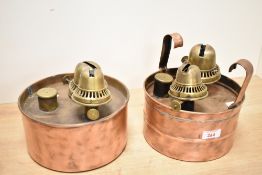 Two late 19th to early 20th-century British copper and brass double burner oil lamps, often used