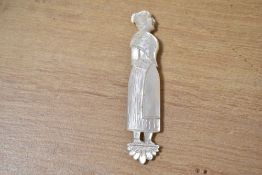 A 19th-century French-style hand carved mother-of-pearl figural needle case, featuring a female