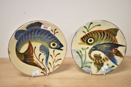 Two mid-20th-century Spanish Puigdemont studio pottery plates, both depicting stylised fish in