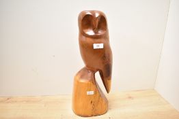 A large mid 20th-century Folk Art-style hand carved pine barn owl sculpture, unmarked, 44cm in