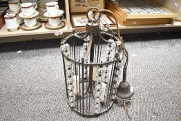 A 20th century decorative metal and crystal glass chandelier, featuring a cage-like structure,