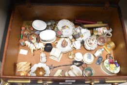 A collection of interesting sundry items, to include miniature porcelain items, a red stained