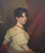 An 18th Century oil on canvas portrait 'Sarah Moore', depicted looking elegantly over one shoulder