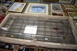 A pair of 1920's Art Deco stained glass window panels still within wooden frames, both in good