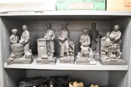 A group of six heavy black resin figures comprising 'Avicenna', 'The Instructor', 'The