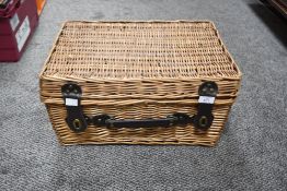 A wicker picnic basket 45cm x 29cm.