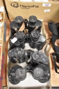 Four pairs of various makes of binoculars