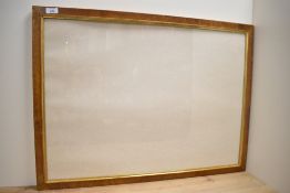 A large wooden picture frame having damage to corners. 79cm x 60cm.