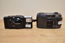 Two cameras. An Olympus XA1 with electronic flash A9M and a Hanimex Genie