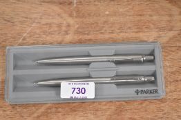 A boxed Parker ballpoint pen and pencil set in brushed steel