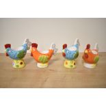 A set of four funky Marks and Spencer egg cups modelled as hens.