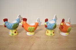 A set of four funky Marks and Spencer egg cups modelled as hens.