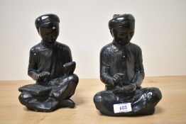 Two mid 20th-century black chalkware Austin Productions figures, The Scholar and The Scribe,