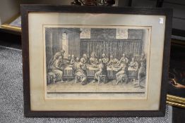 A print of an etching depicting the Last Supper mounted, framed and glazed 70cm x 54cm.