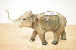 A mid century pottery elephant study, bearing stamp '531' to underside, measuring 12cm tall.