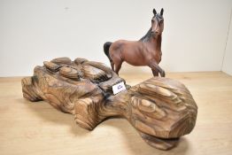 A Royal Doulton bone china horse study in matt brown finish sold alongside an unusual wooden